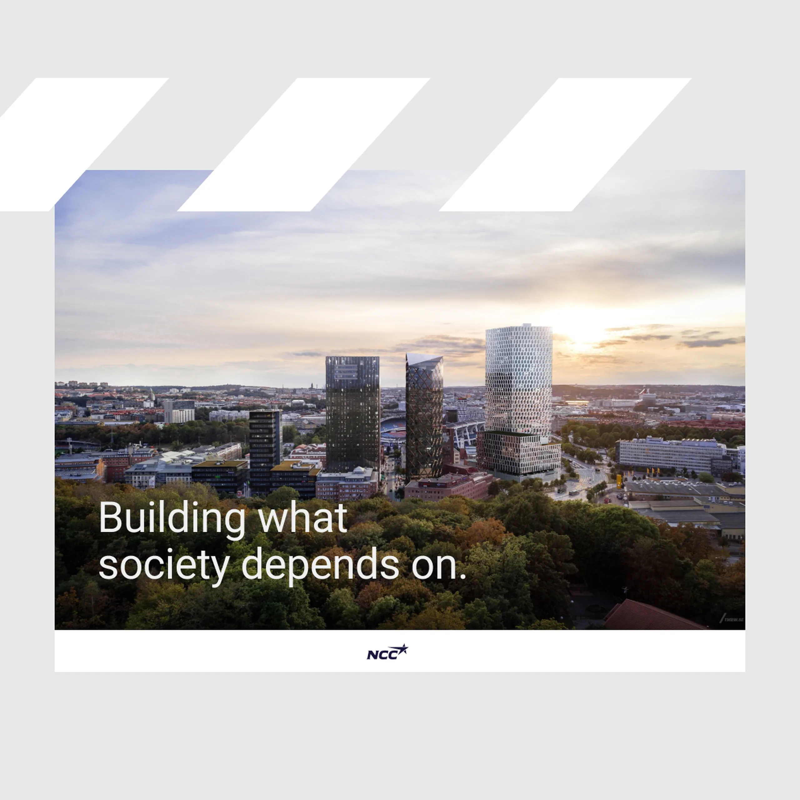 NCC presentation slide with an aerial view of three high-rise towers at sunset and the text "Building what society depends on."