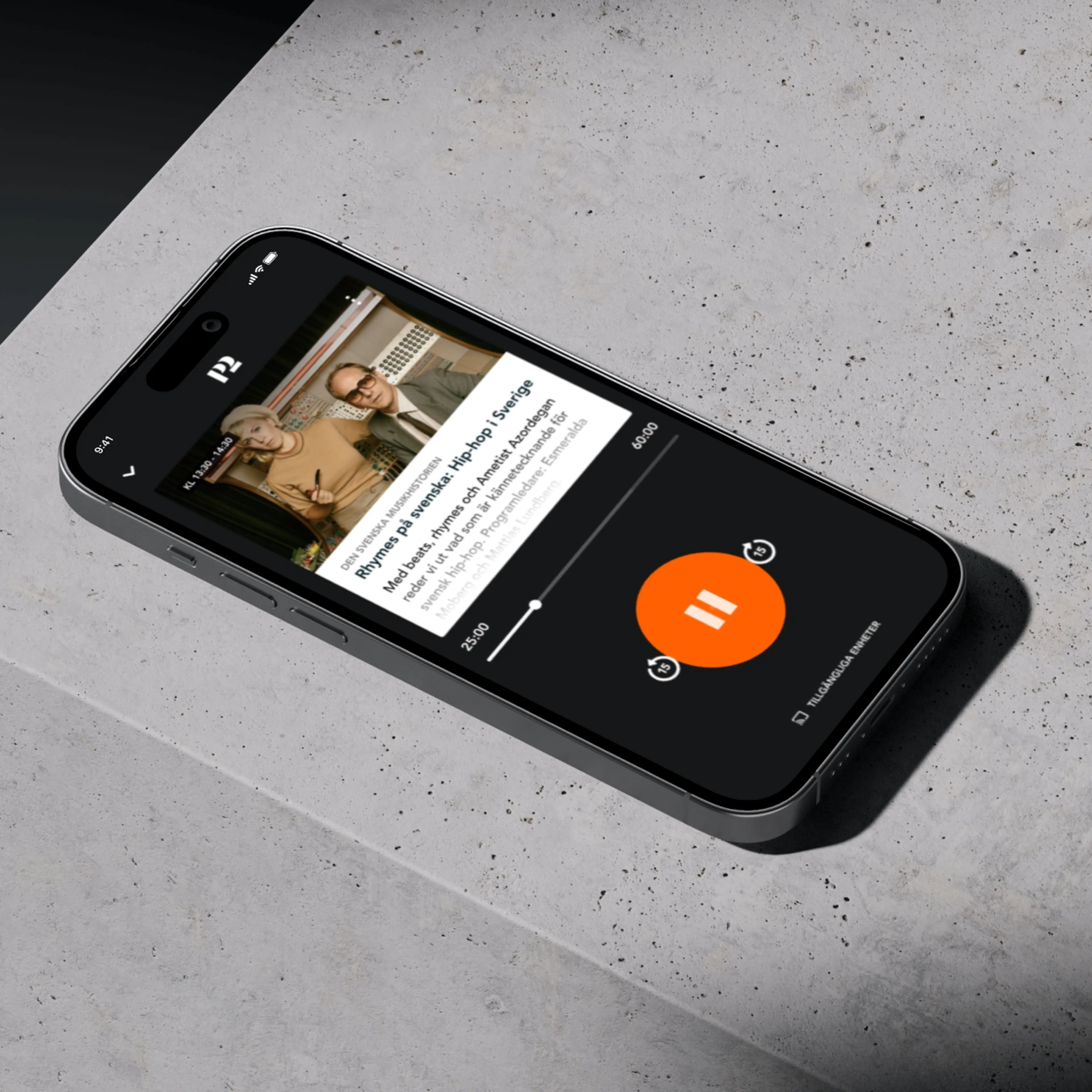 Smartphone on concrete surface displaying a paused stream from Sveriges radio app.